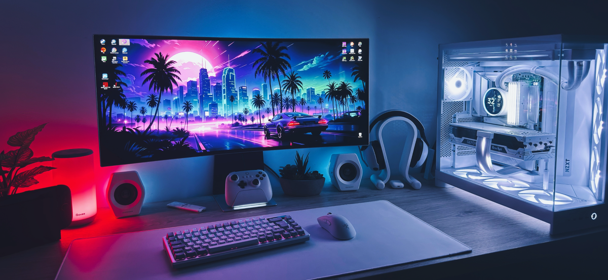 Setups contest winner: an ultrawide monitor with a synthwave wallpaper beside a white NZXT case with an AIO LCD