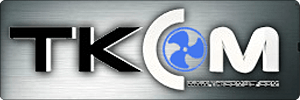 TKCOM logo with bold black and white letters; the O has a blue fan icon in the center. Background is metallic gray with a small, illegible tagline below the main text.