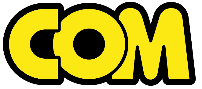 The image shows the word COM in bold, uppercase yellow letters with a thick black outline. The font is rounded and playful.