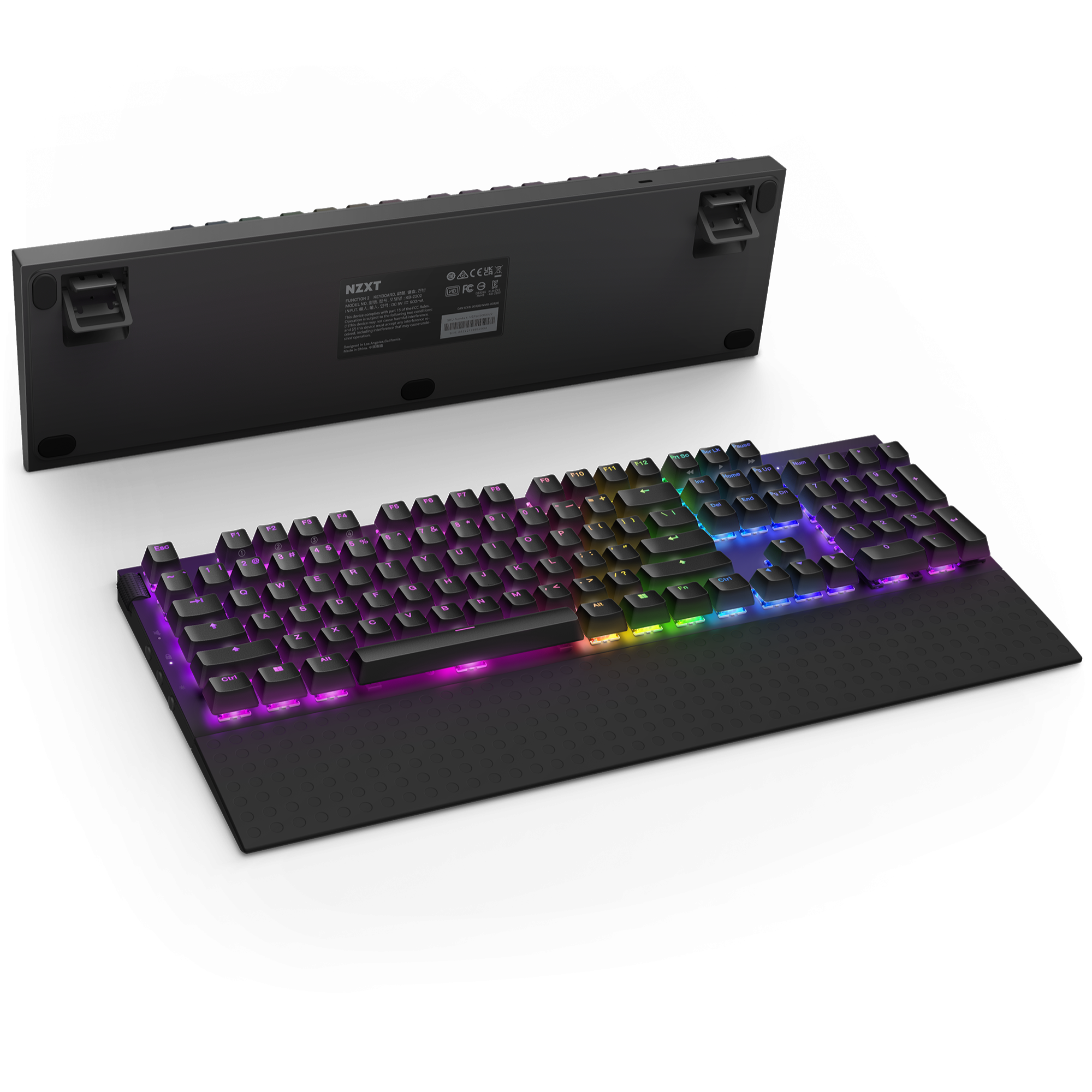 The NZXT Function 2 + Lift 2 Ergo+ MMP400 is a black keyboard with RGB backlighting, NZXT Swift Optical Switches, a detachable wrist rest, adjustable feet, and a product label visible on the back.