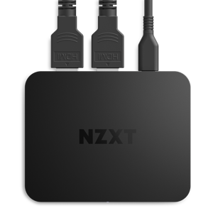 A top-down view of the black NZXT Signal HD60 capture card, with two HDMI cables and one audio cable connected to the top ports, designed for ultra-low latency and seamless zero-lag passthrough.