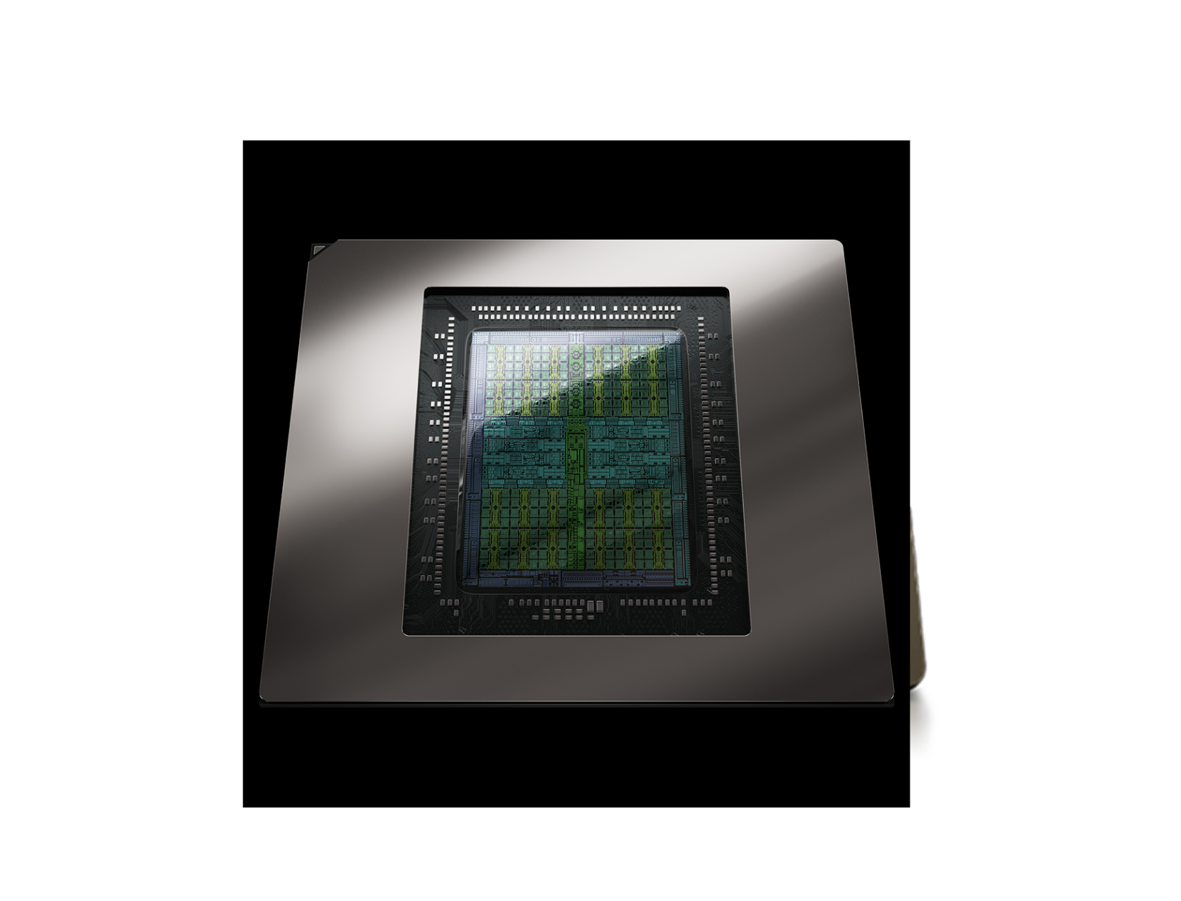 A close-up of a computer chip or processor with a reflective metallic frame and intricate circuit patterns visible under a protective transparent cover.