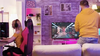 Person playing their gaming PC with a TV instead of a gaming monitor