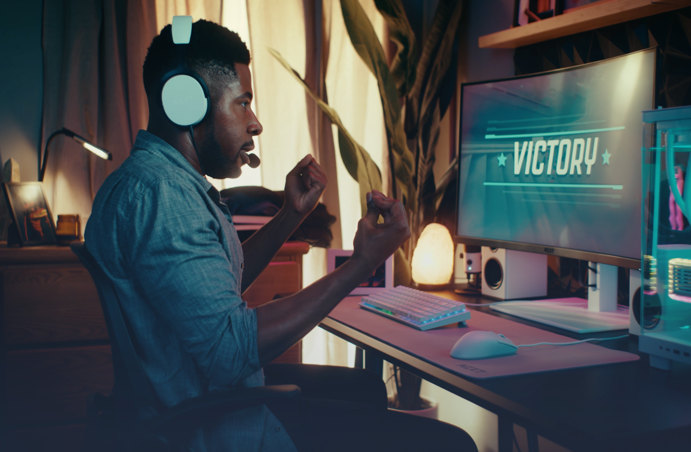 Male gamer playing a game, victory on screen using Function 2 and Lift 2