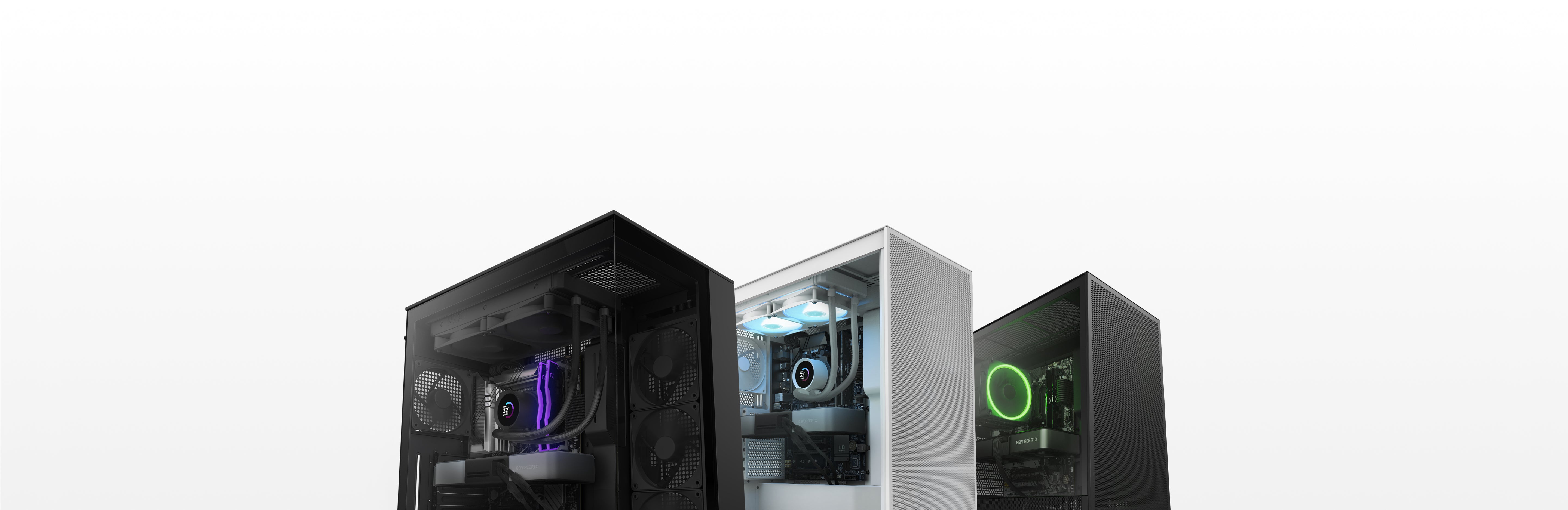Three desktop computer towers in black and white, each with visible internal components and colorful LED lighting, are displayed against a plain white background.