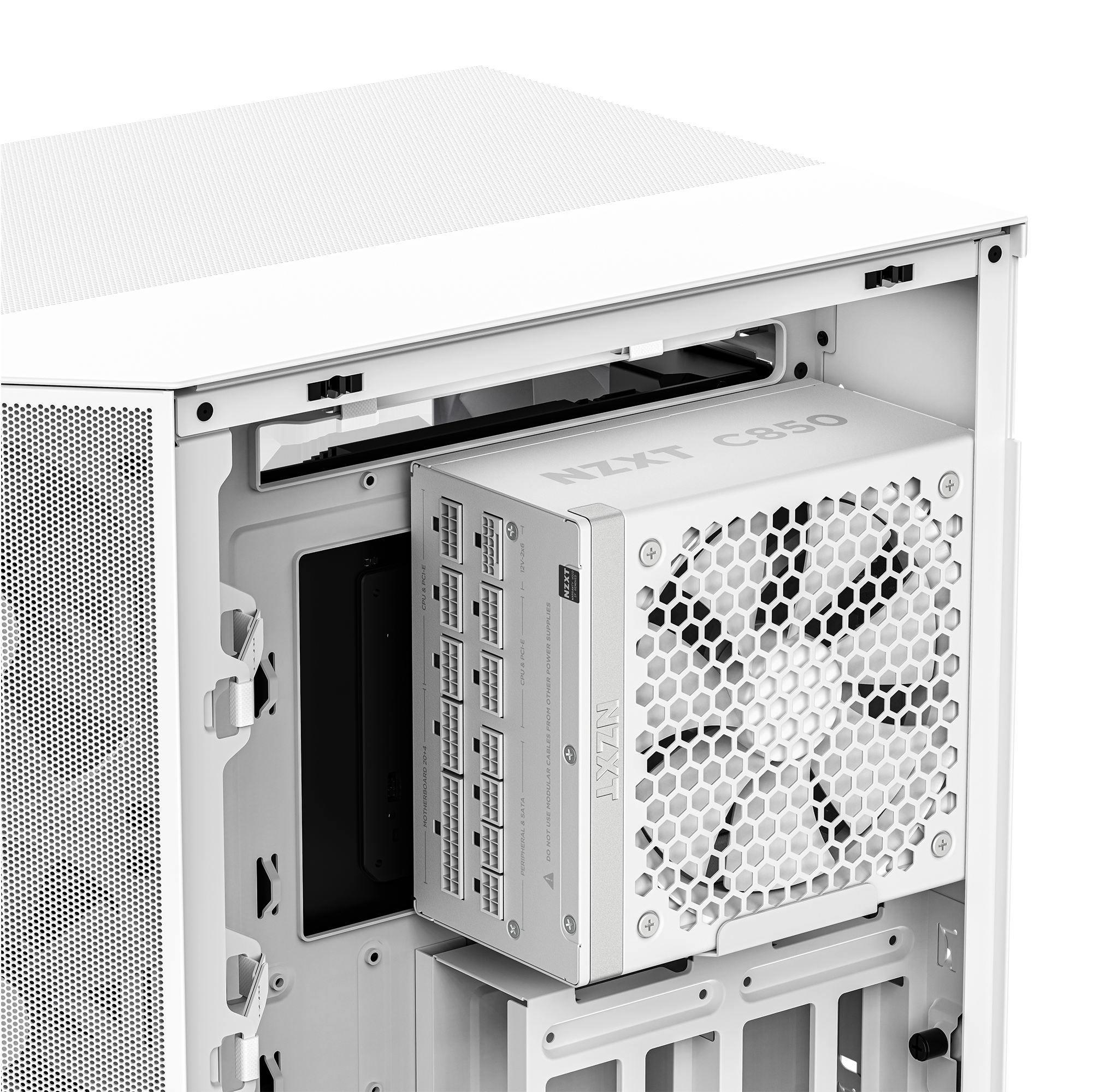 A close-up of the interior of a white computer case shows an NZXT C850 Gold ATX 3.1 power supply installed behind a large white cooling fan, with mesh ventilation and cable management openings visible.