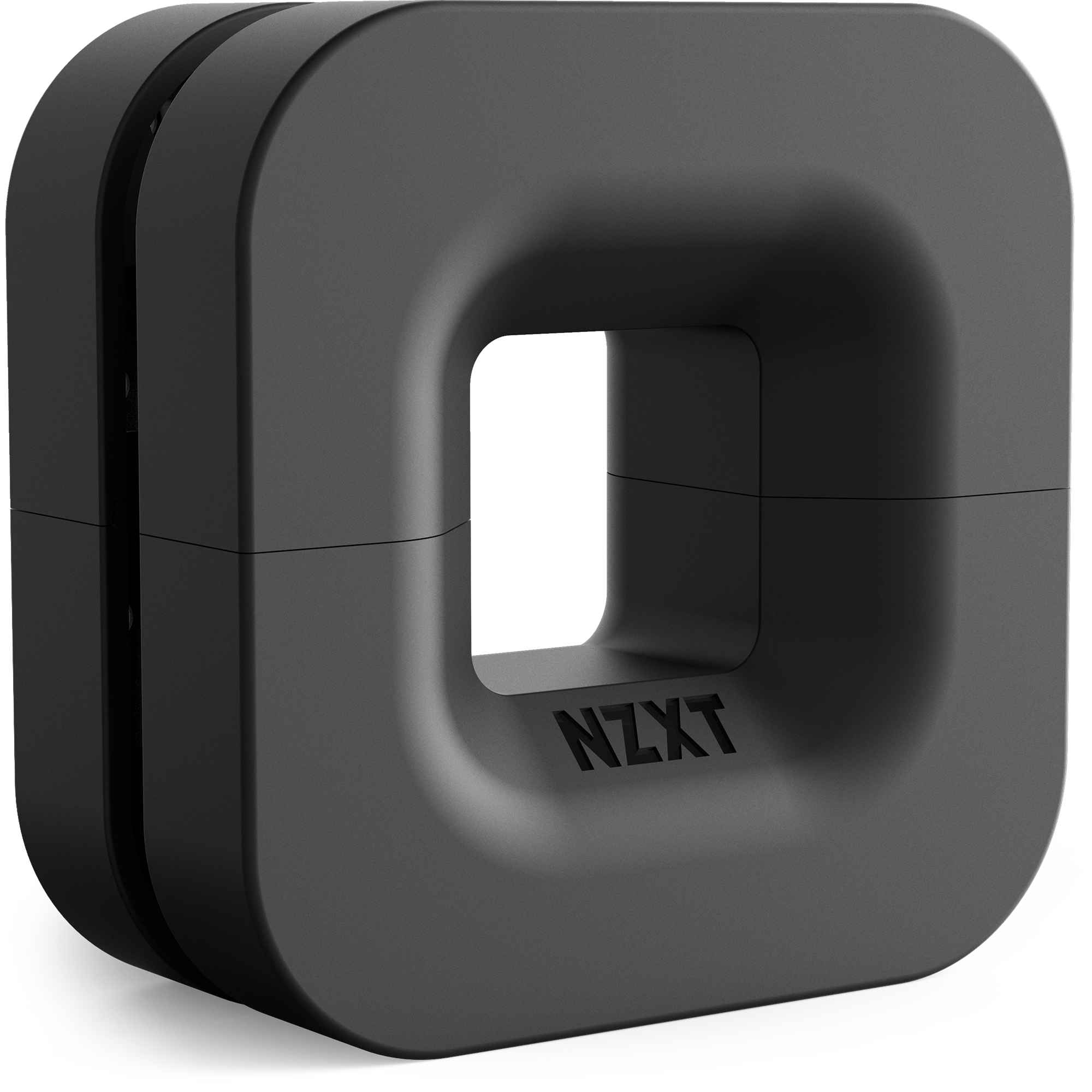 The NZXT Puck is a matte black, square-shaped device with rounded edges and a hollow center, engraved with NZXT on the front. It’s designed for magnetic cable management or as a sleek headset mount.