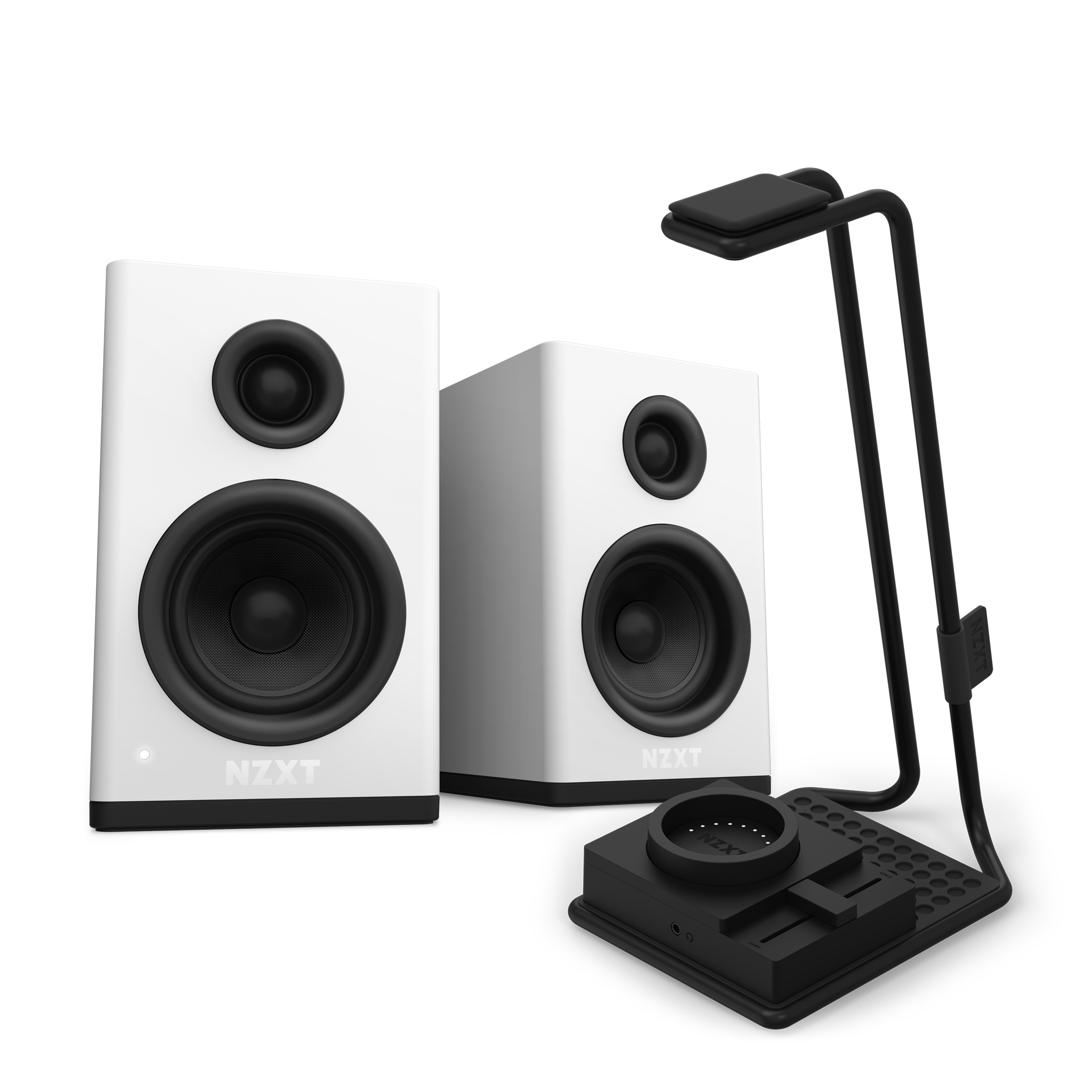 Two NZXT Relay Speakers with black cones are placed beside a black SwitchMix desk stand, which organizes small electronics and cables, delivering high-resolution audio to your workspace.